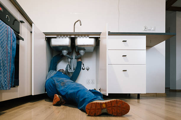 Professional Emergency Plumber technician working in Amherst, OH